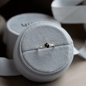 MAIDEN engagement ring with a natural green sapphire and diamonds in a ring box