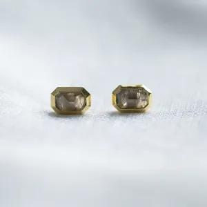 Horizontal view of NYLA gold stud earrings with salt and pepper diamonds