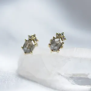 Close-up of TERRA stud earrings with salt and pepper diamonds