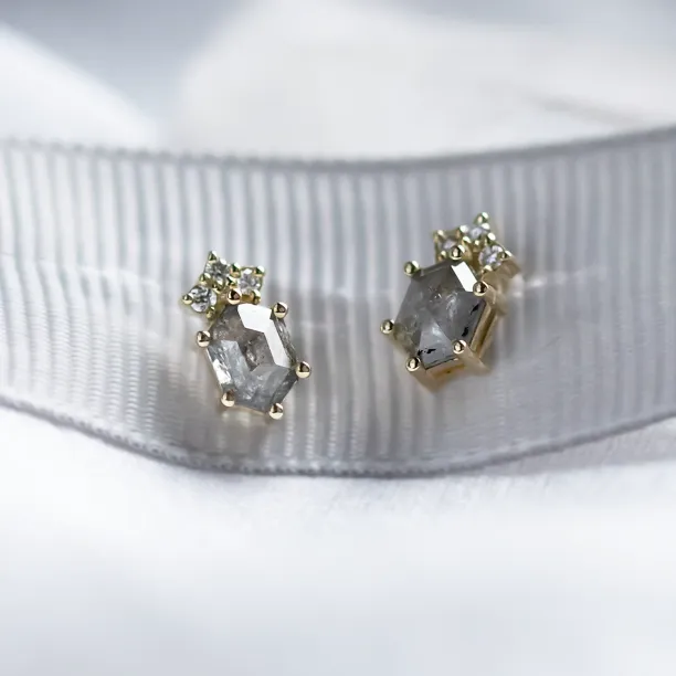 Angled close-up of TERRA earrings with salt and pepper diamonds