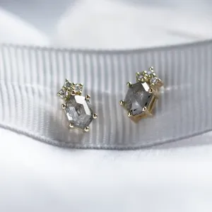 Angled close-up of TERRA earrings with salt and pepper diamonds