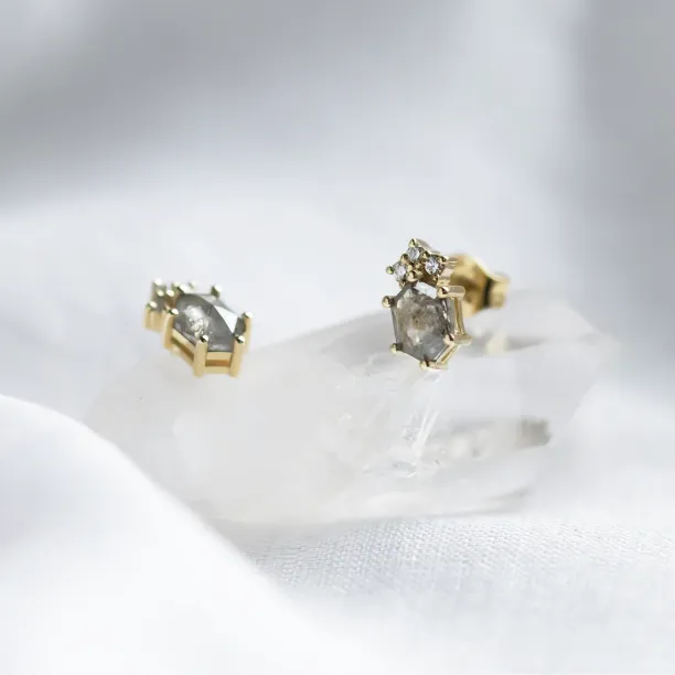 Side detail of TERRA stud earrings with salt and pepper diamonds