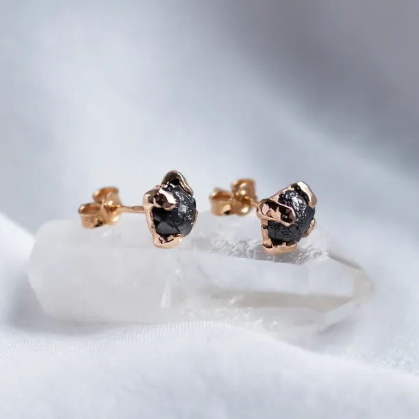 Angled view of CORDELIA earrings showing the diamond settings and posts