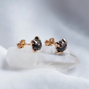 Angled view of CORDELIA earrings showing the diamond settings and posts
