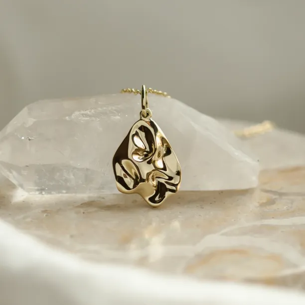 Close-up of the HEARTBEAT necklace pendant with an organic heart-inspired shape