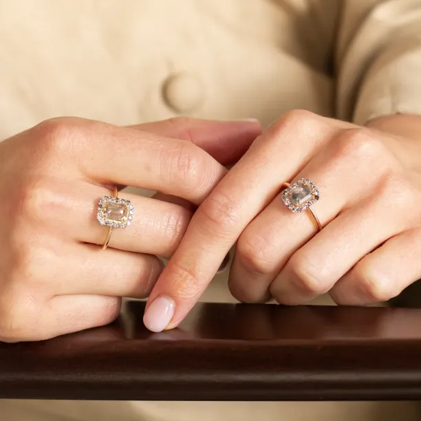 Two LUCIANA salt and pepper diamond rings displayed on hands