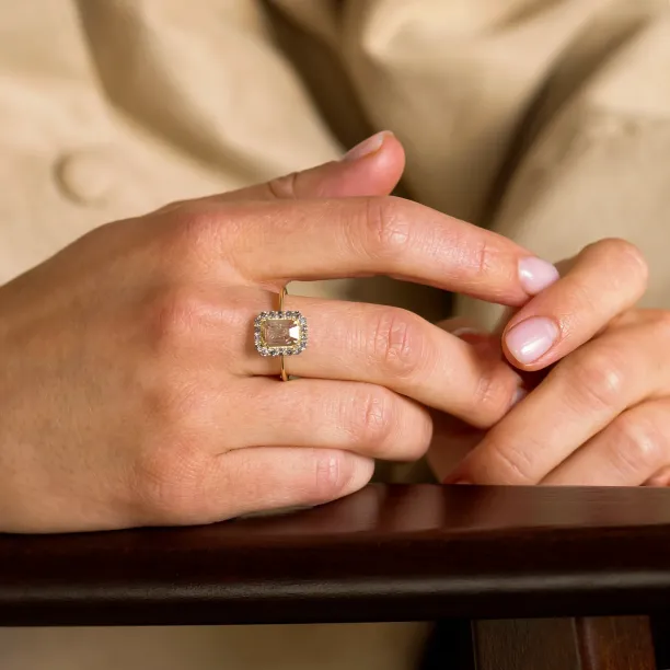 LUCIA gold ring with salt and pepper diamonds worn on a hand