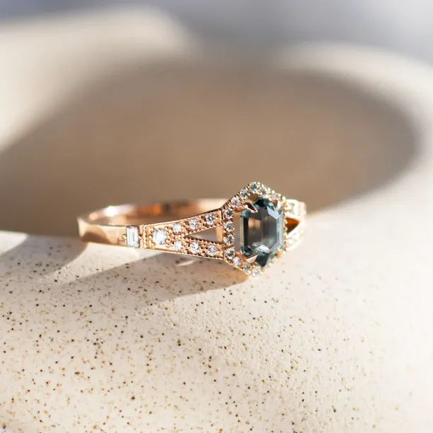 Angled view of the HARRIET engagement ring with sapphire and diamond-set band