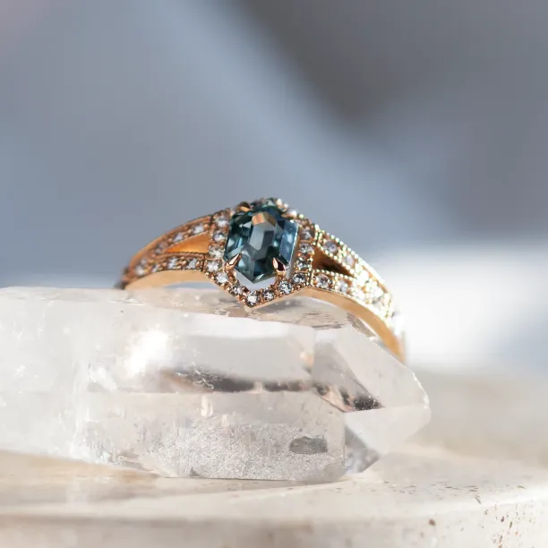 Close-up of the HARRIET ring’s teal sapphire and surrounding diamonds