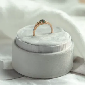 Profile view of the HARRIET engagement ring with raised teal sapphire