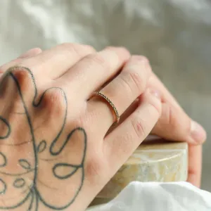 DORA half eternity gold ring with salt and pepper diamonds worn on the hand