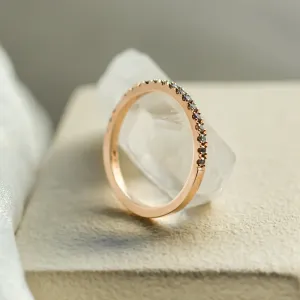 Angled view of DORA half eternity ring showing its plain band section