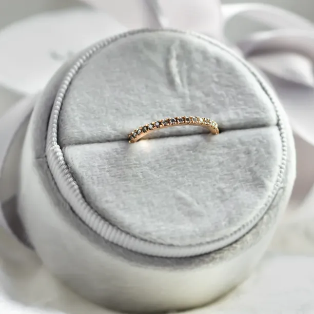 Close-up of DORA half eternity ring highlighting the salt and pepper diamonds