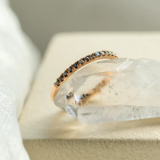 Close-up of the salt and pepper diamond row on DORA half eternity ring