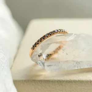 Close-up of the salt and pepper diamond row on DORA half eternity ring