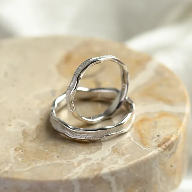 SAVANNAH wedding rings, one upright to reveal the inner surface