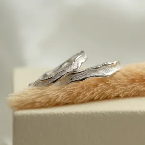 Angled view of SAVANNAH matching wedding rings showing textured surfaces