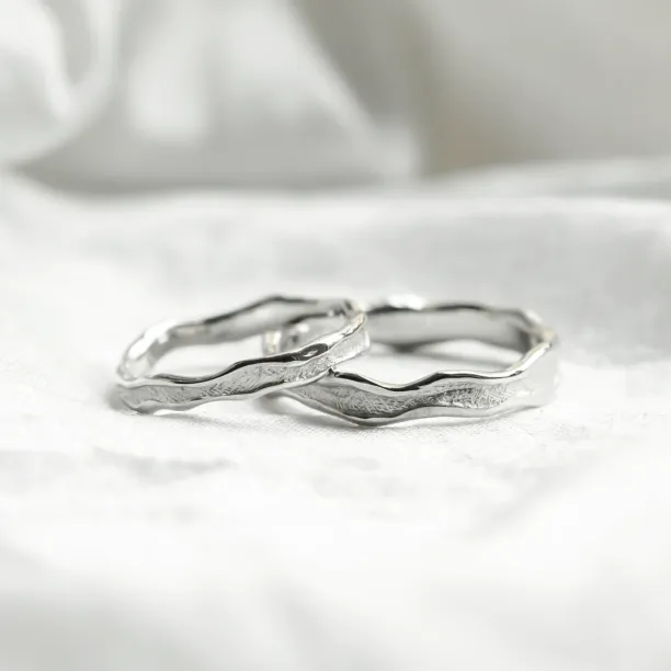 SAVANNAH matching wedding rings with an irregular textured surface