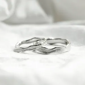 SAVANNAH matching wedding rings with an irregular textured surface