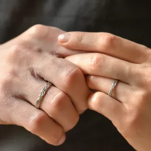 KIRSTEN textured wedding rings worn on two hands