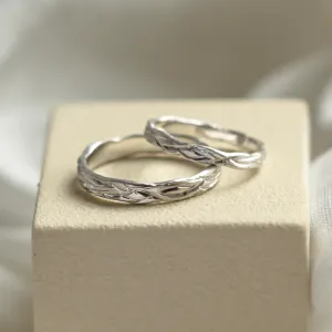 Angled view of KIRSTEN textured wedding rings