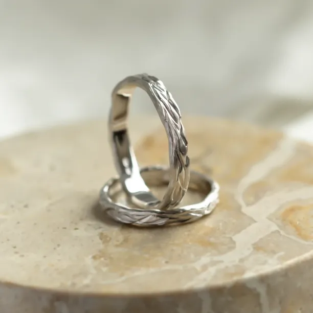 KIRSTEN wedding rings showing their textured hand-scratched surfaces
