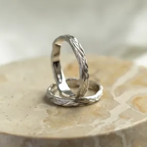 KIRSTEN wedding rings showing their textured hand-scratched surfaces