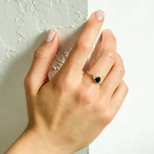 BLACKIE engagement ring with a black pear diamond worn on the hand