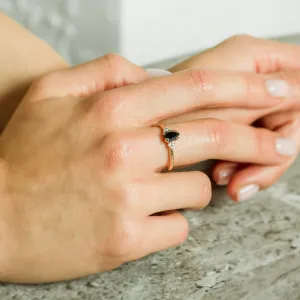 Close-up of the BLACKIE engagement ring worn on the hand
