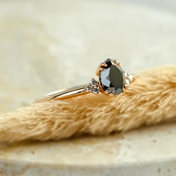 Side view of the BLACKIE engagement ring with a black pear diamond