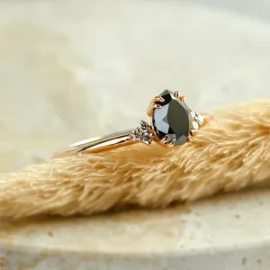 Side view of the BLACKIE engagement ring with a black pear diamond
