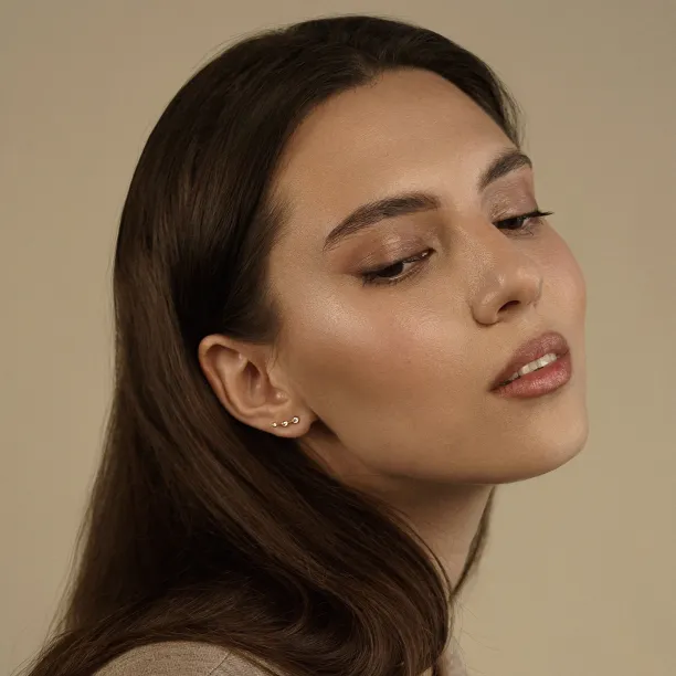 MARIAN minimalist diamond earring worn on the ear