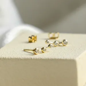 Angled view of MARIAN minimalist diamond earrings