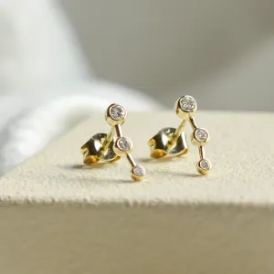 Close-up of the MARIAN minimalist diamond earrings