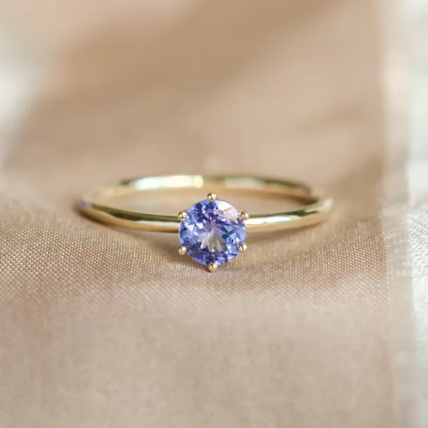 Close-up of the TANJA engagement ring and faceted tanzanite