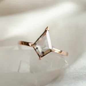 Angled close-up of the CASEY gold ring and its kite-shaped diamond