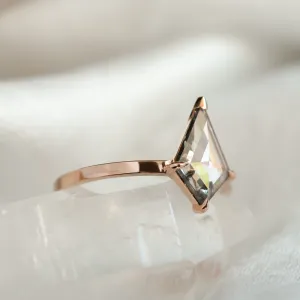 Close-up angled view of CASEY gold engagement ring with lab-grown salt and pepper kite-shaped diamond