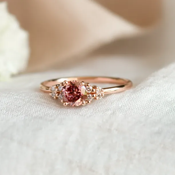 Angled close-up of the EDDY engagement ring with pink lab grown diamond