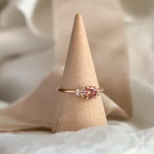 EDDY engagement ring with pink lab grown diamond displayed on a ring stand