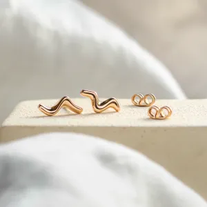 Rose gold MIGNON wave earrings shown as a pair