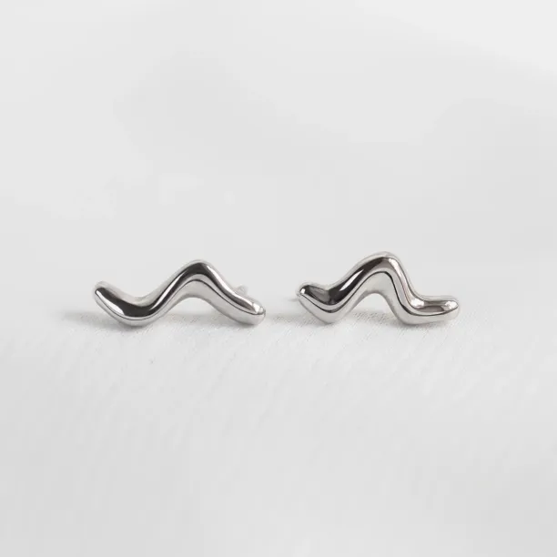 Pair of MIGNON wave earrings in a clear product view