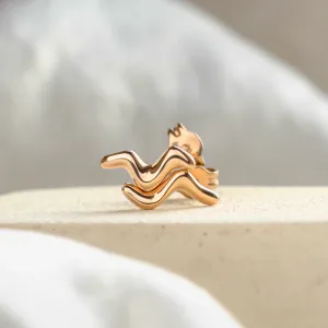 Close-up of MIGNON wave earrings showing their curved design
