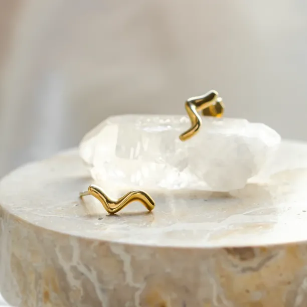 Gold MIGNON wave earrings shown together in a close-up
