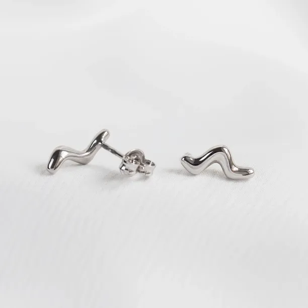 MIGNON wave earrings shown as a pair with one fastening visible