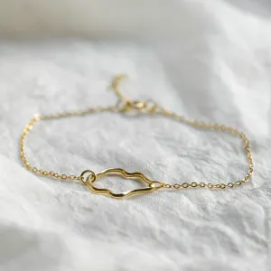 Full view of the MICHELE gold bracelet with an irregular centerpiece