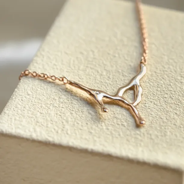 Angled close-up of the MADELEINE diamond necklace pendant