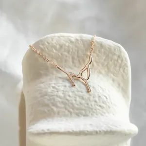 Close-up of the irregular MADELEINE necklace pendant with diamond