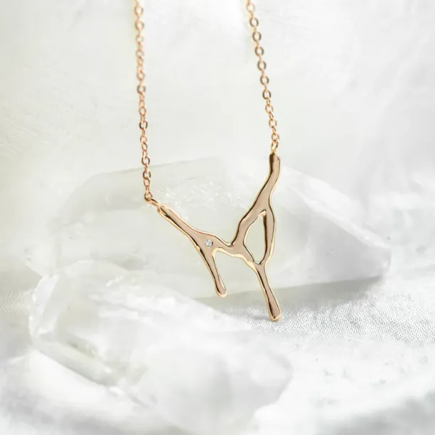 MADELEINE dripping liquid necklace with diamond, shown in close-up