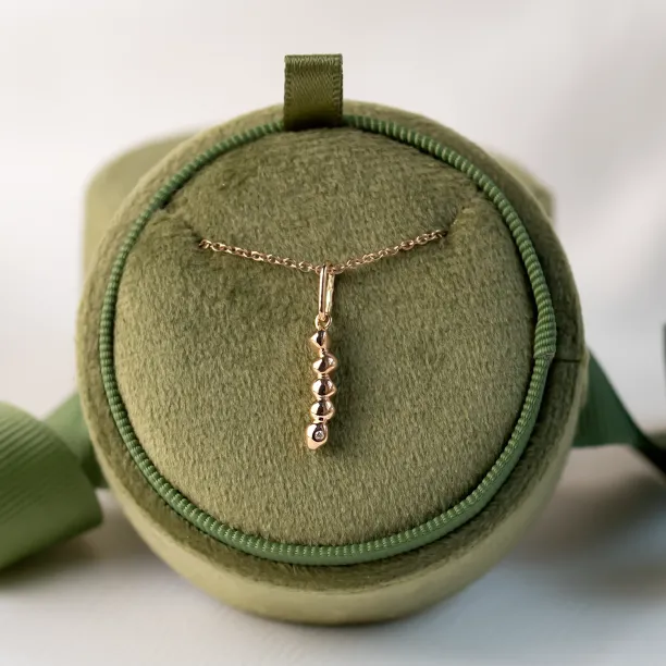 Full view of the minimalist gold CORINNE necklace with diamond pendant