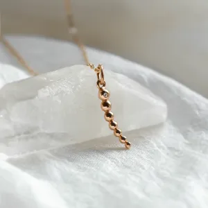 Close-up of the CLAUDE necklace pendant with a diamond